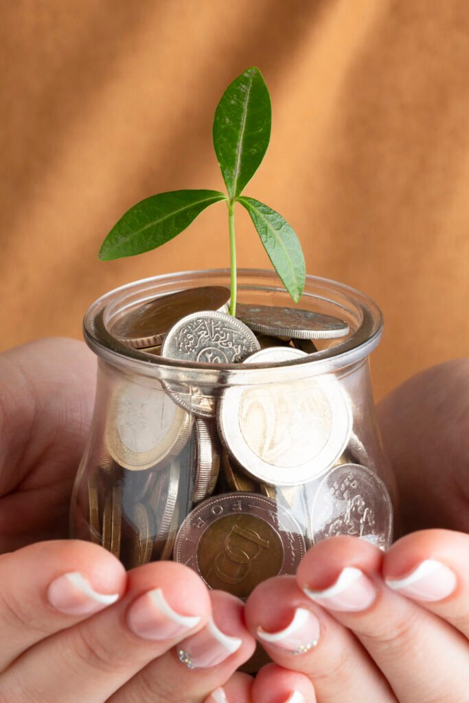 person-holding-jar-coins-hands